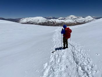 Man skiing on snow covered landscape