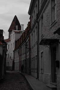 Narrow street amidst buildings in town