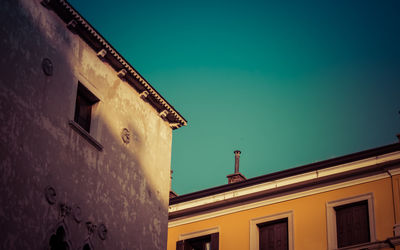 Low angle view of house against clear blue sky