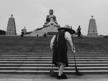 Low angle view of woman standing in park