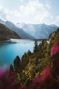 Scenic view of lake and mountains against sky