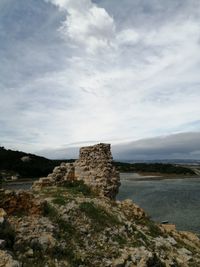 Low angle view of rocks against sky