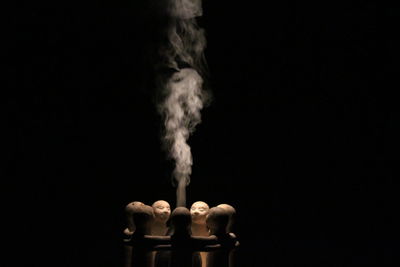 Wooden objects surrounded by smoke