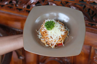 High angle view of chopped slices in bowl on table