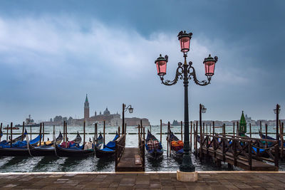 View of boats moored in canal