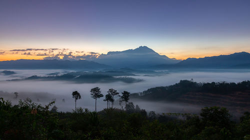 Scenic view of mountains against sky during sunset