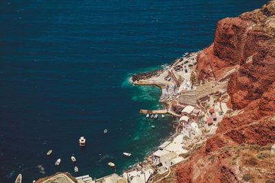 High angle view of sea and rocky mountain