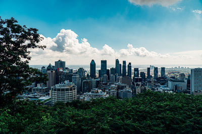 Modern buildings in city against sky