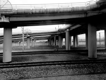 Railroad track with bridge in background