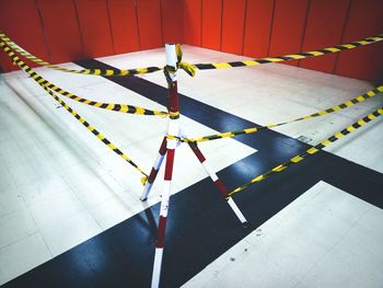 High angle view of empty chairs on tiled floor