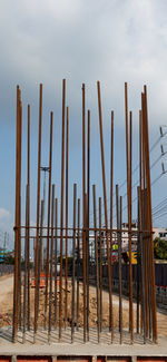 Panoramic view of wooden post against sky