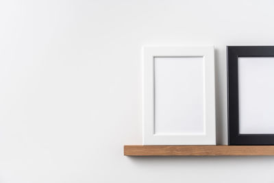 Close-up of empty chair against white background