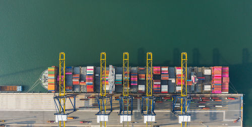 Aerial view of container ship moored at harbor