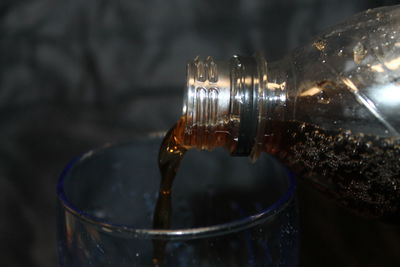 Close-up of drink pouring in glass