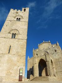 Low angle view of bell tower against sky