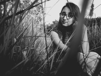 Portrait of young woman in field