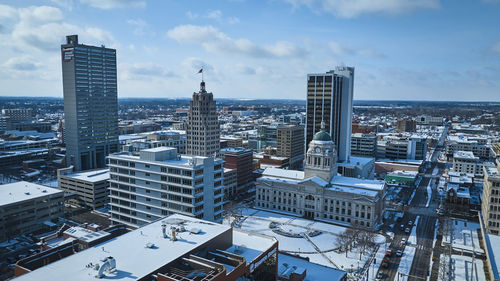 Modern buildings in city against sky