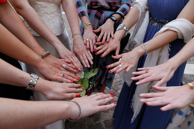 Midsection of woman touching hands