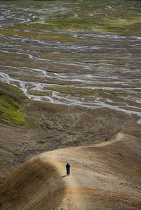 High angle view of man walking on land