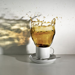Coffee splashing against wall