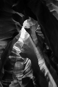 A view of rock formation on anthelope canyon. a ray of light enters between rocks.