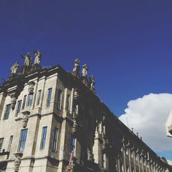 Low angle view of building against blue sky