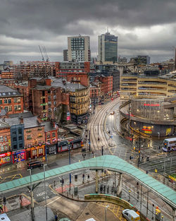 High angle view of city street and buildings against sky