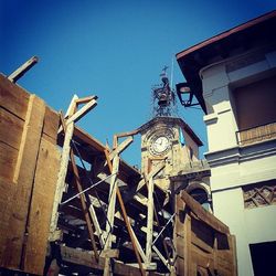Low angle view of building against clear blue sky