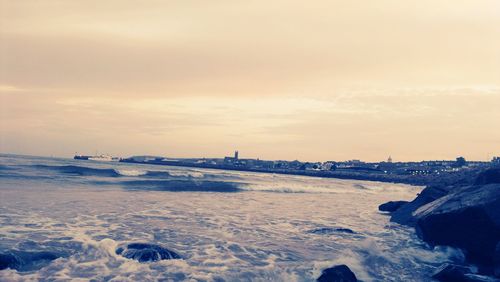 Scenic view of frozen sea against sky during sunset