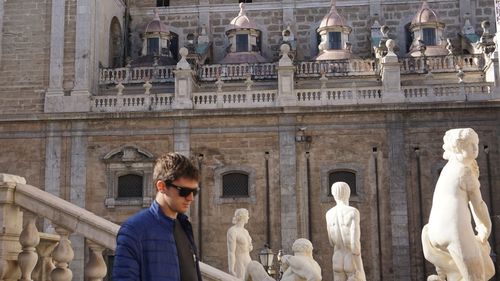 Young man visiting historical building