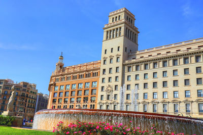 Low angle view of building against blue sky