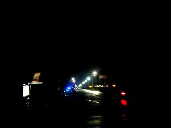 Illuminated road at night