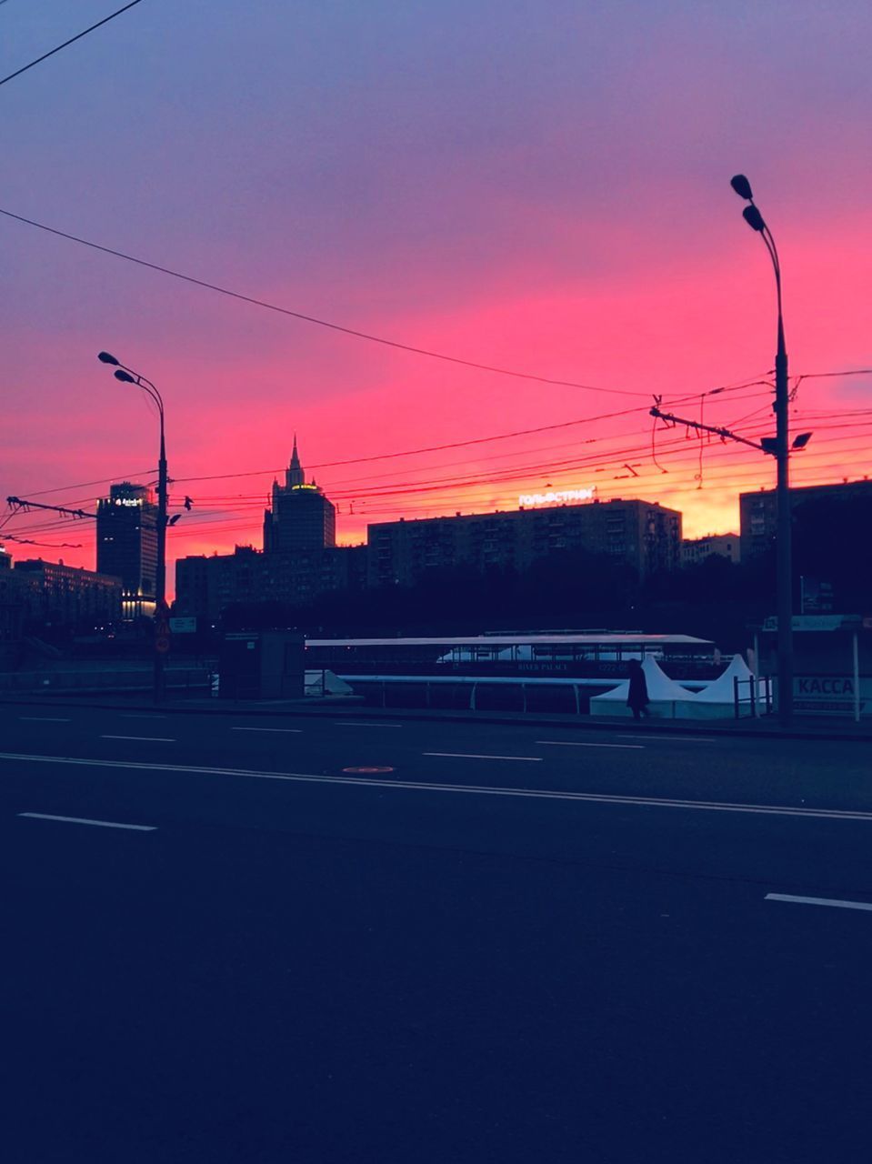 CITY STREET AGAINST ORANGE SKY