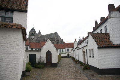 Buildings in town against sky