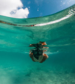 Woman swimming in sea