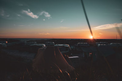 Panoramic view of sea against sky during sunset with tent