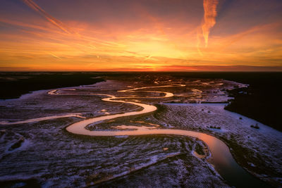 Aerial view of sea during sunset