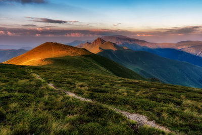 Scenic view of landscape against sky during sunset