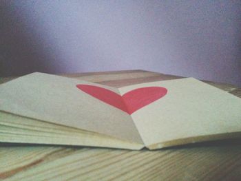 High angle view of heart shape on book