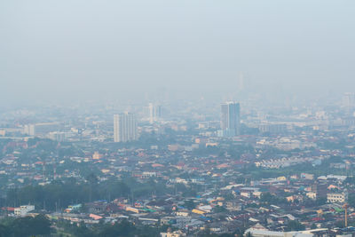 High angle view of buildings in city against sky