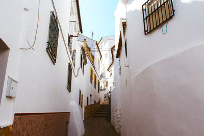 View of alley amidst buildings