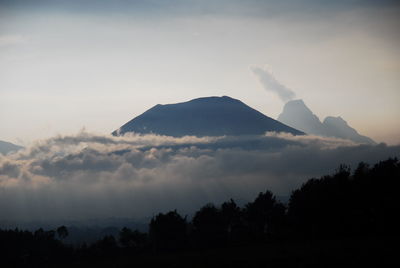 Scenic view of silhouette mountains against sky