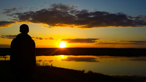 Silhouette of people at sunset