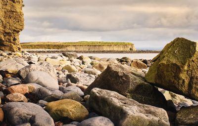 Dramatic cloudy landscape scenery of rocky coast at silverstrand beach in galway, ireland