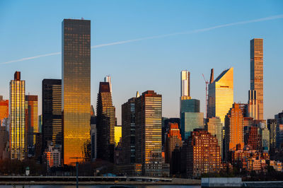 Modern buildings in city against sky