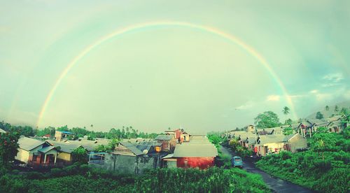 Scenic view of rainbow over landscape