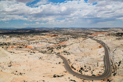 Road on desert against sky