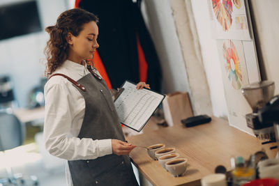 Barista preparing coffee at cafe