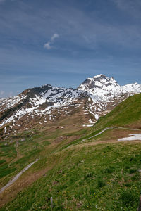 Scenic view of snowcapped mountains against sky