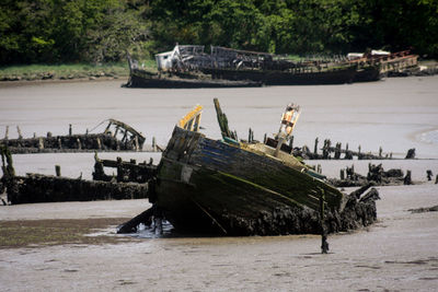 Abandoned boat at sea shore